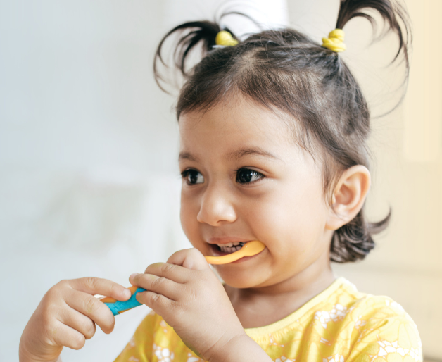 Girl burshing her teeth